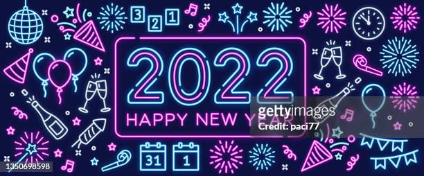 happy new year 2022 with neon text and icons. - neon lights stock illustrations