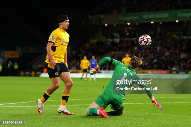 Raul Jimenez of Wolverhampton Wanderers scores their team's second goal past Jordan Pickford of Everton during the Premier League match between...