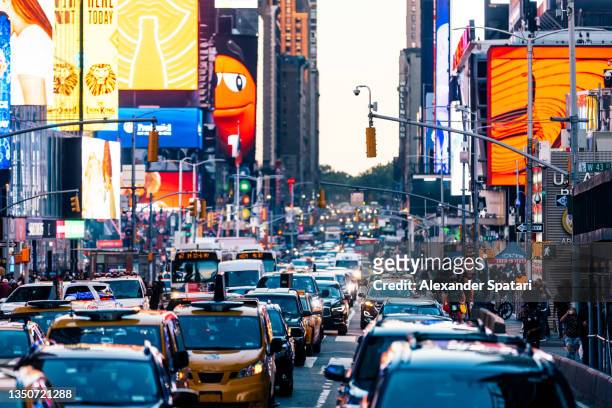 traffic jam at times square, new york, usa - traffic light city stock-fotos und bilder