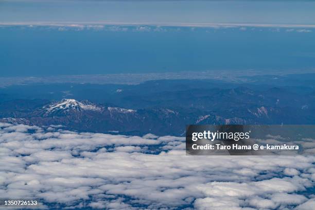 snowcapped mt. haku in gifu and ishikawa of japan aerial view from airplane - hakusan stock pictures, royalty-free photos & images