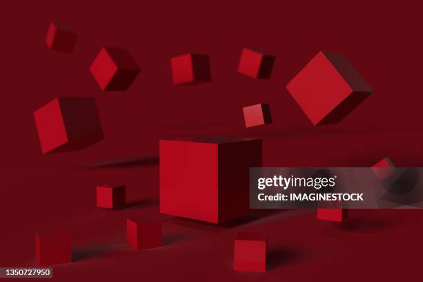 three-dimensional cubes flying on a red background - 立方体 ストックフォトと画像