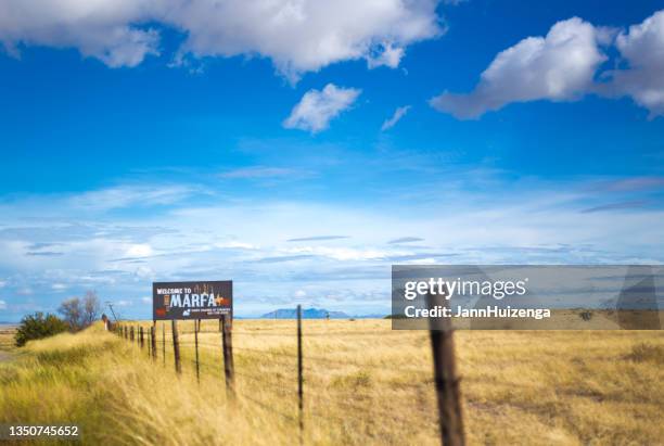 marfa, tx: road sign reading "welcome to marfa" - marfa texas stock pictures, royalty-free photos & images