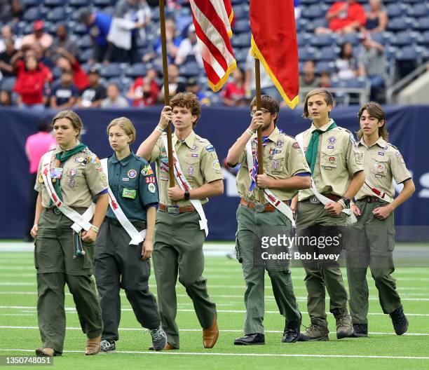 Boy Scouts of America present the colors during the national anthem before the Los Angeles Rams and the Houston Texans at NRG Stadium on October 31,...