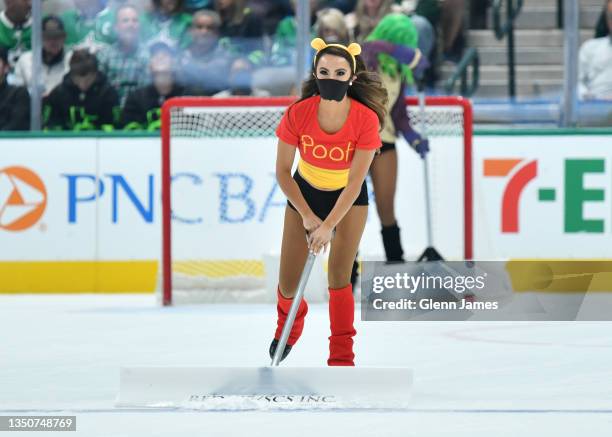 The Dallas Stars Ice Girls clean the ice during a stop in the action against the Ottawa Senators at the American Airlines Center on October 29, 2021...