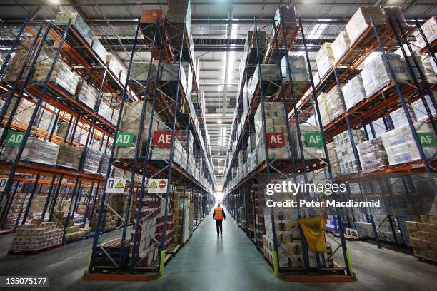 Staff move among the goods stored at Sainsbury's Waltham Point distribution depot on December 6, 2011 in Waltham Abbey, England. The depot is the...