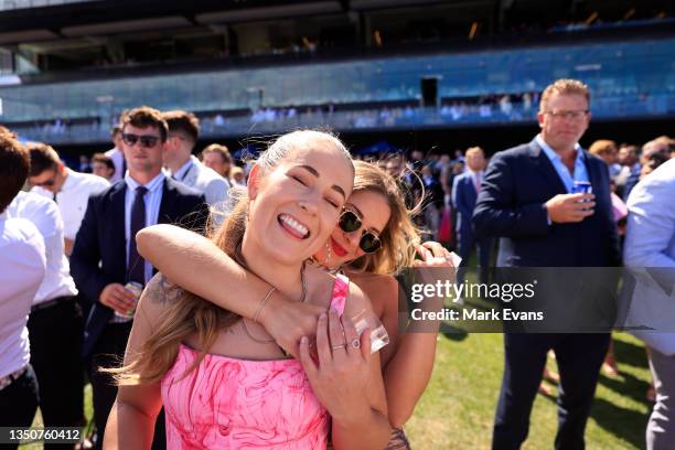 The crowd celebrate after watching the Melbourne Cup on the big screen during Sydney Racing at Royal Randwick Racecourse on November 02, 2021 in...