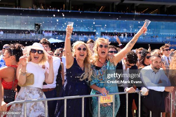 The crowd celebrate after watching the Melbourne Cup on the big screen during Sydney Racing at Royal Randwick Racecourse on November 02, 2021 in...