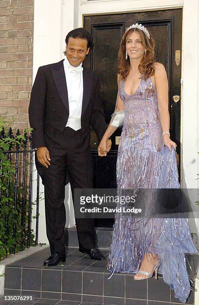 Arun Nayer and Elizabeth Hurley during Elizabeth Hurley Leaves Her House to Attend Elton John's White Tie and Tiara Ball - June 23, 2005 at Private...