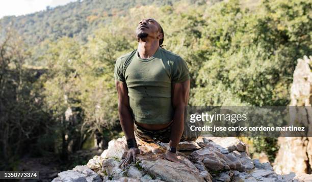 military man mountain meditation, camouflage clothing - african american soldier bildbanksfoton och bilder