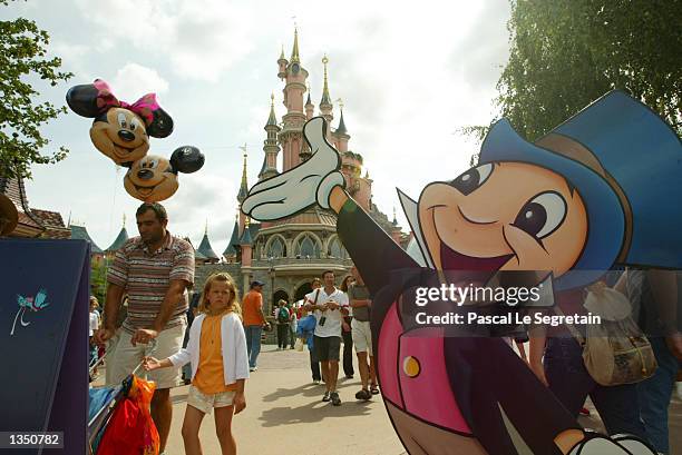 Cutout of Jiminy Cricket welcomes visitors to Fantasyland in Disneyland Paris is shown August 22, 2002 in Marne la Vallee, France. After a rocky...