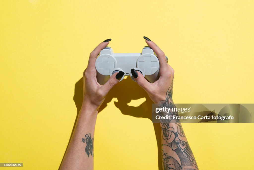 Woman's Hands Holding Joystick