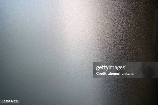 side lit matte metallic texture - brightly lit ストックフォトと画像