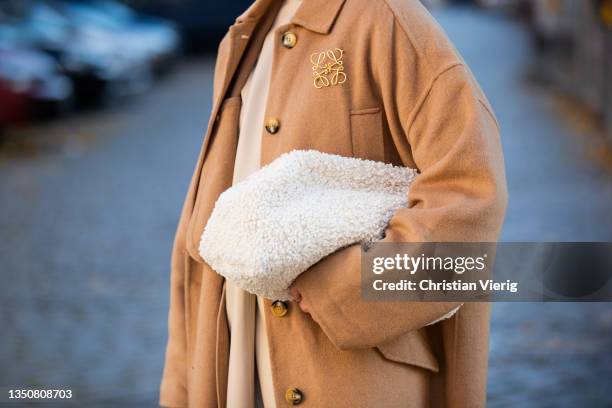 Tina Haase wearing beige Second female Camel coat, Loewe clasp, Inwear beige Leather dress, Brown croco overknee boots , COS teddy pouch bag. On...