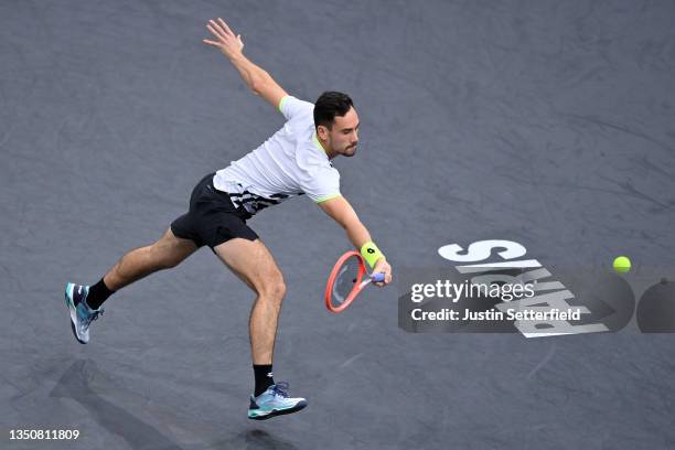 Gianluca Mager of Italy plays a backhand during his singles match against Felix Auger-Aliassime of Canada during day two of the Rolex Paris Masters...