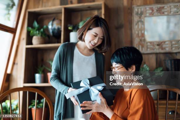 https://media.gettyimages.com/id/1350827413/photo/a-senior-asian-mother-receiving-a-present-from-her-daughter-at-home-the-love-between-mother.jpg?s=612x612&w=gi&k=20&c=O5RDUgIFyWUBr8m3yEQtmDUPUK44m5jI-s0RSVP61oY=