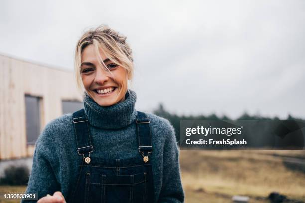 portrait of smiling female in nature - blonde attraction stock pictures, royalty-free photos & images