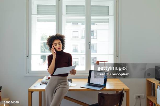 business woman talking on a mobile phone at home - talk phone flat imagens e fotografias de stock