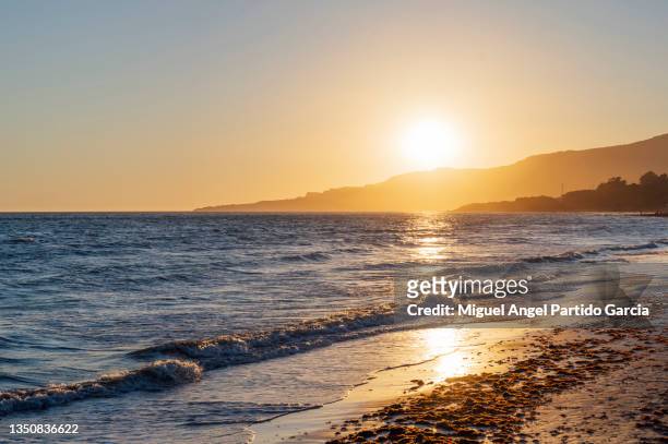 sunset over the ocean, tarifa, spain - tarifa stock pictures, royalty-free photos & images