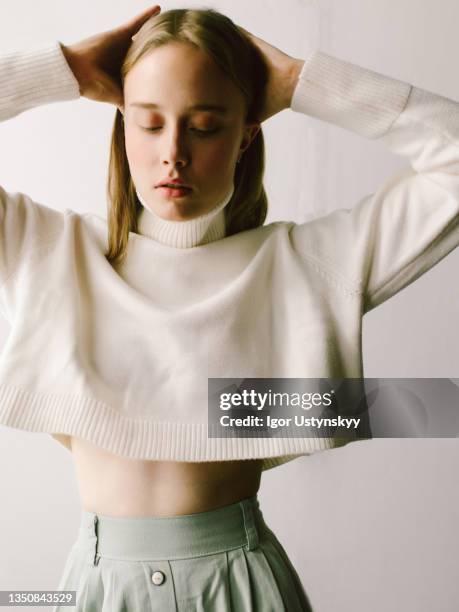 young beautiful woman making hairstyle - skinny blonde pics stock pictures, royalty-free photos & images