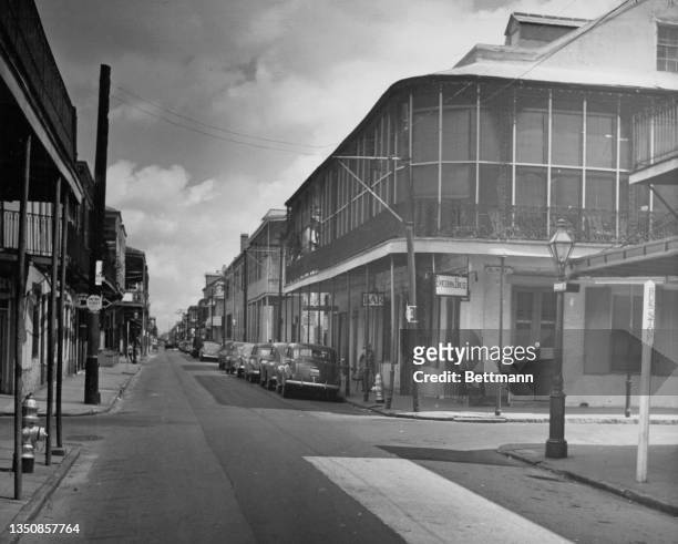 Bourbon Street at the 700 block with Bourbon House, French Quarter, New Orleans, circa 1935.