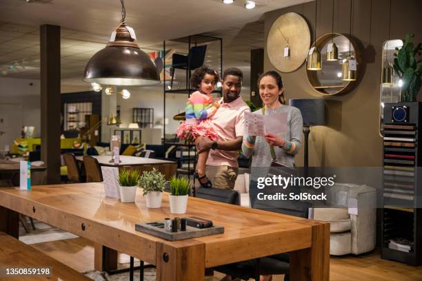 is this table big enough? - luxury home dining table people lifestyle photography people stock pictures, royalty-free photos & images