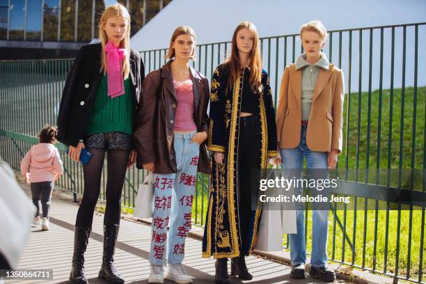 Models Paula Rudevica, Merel Roggeveen, Sara Grace Wallerstedt, and Hannah Motler after the Stella McCartney show on October 04, 2021 in Paris,...