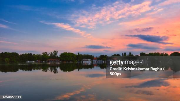scenic view of lake against sky during sunset,maschsee,hanover,germany - hanover germany stock-fotos und bilder
