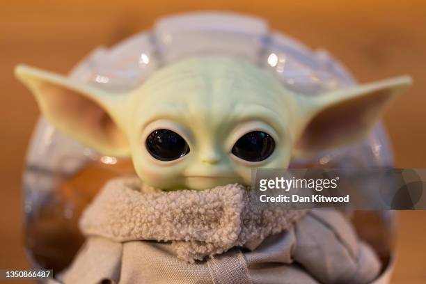 Baby Yoda style toy is displayed during a photocall of the 'Top 12' Christmas toys on November 02, 2021 in London, England. The DreamToys list,...