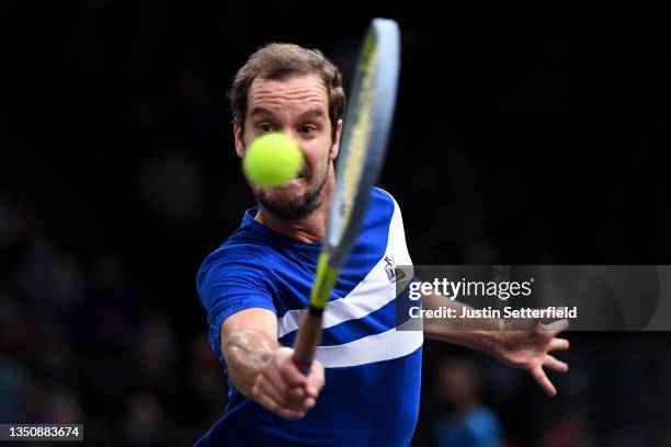 Richard Gasquet of France plays a backhand during his singles match against Grigor Dimitrov of Bulgaria during day two of the Rolex Paris Masters at...