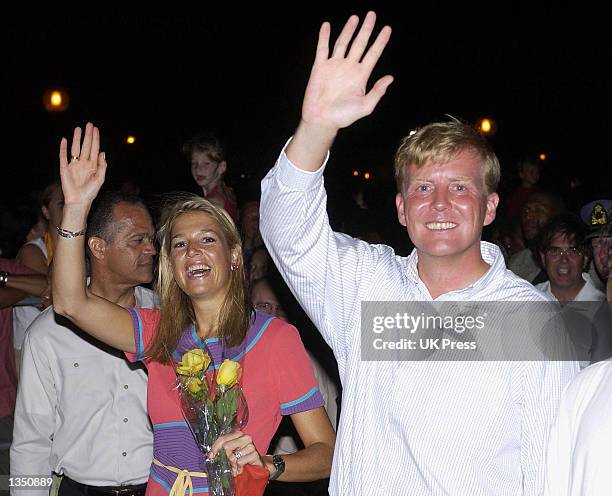 Crown Prince Willem Alexander and Crown Princess Maxima of Holland wave to admirers as they attend a cultural evening of dance and carnival in Brion...