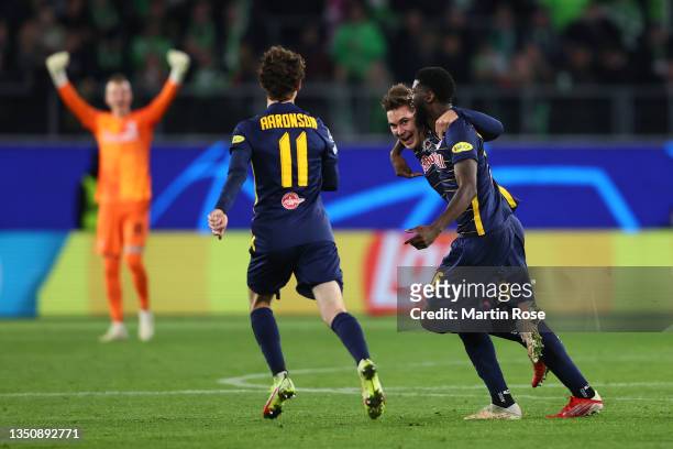 Maximilian Wober of RB Salzburg celebrates with teammates Brenden Aaronson andafter scoring their team's first goal during the UEFA Champions League...