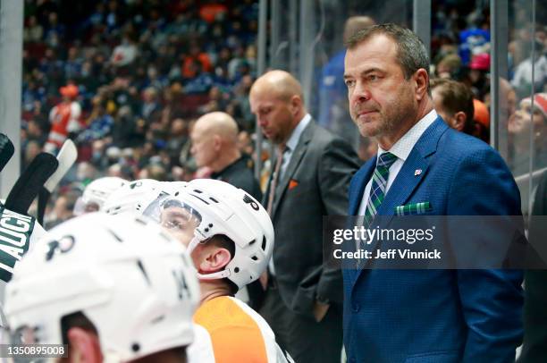 Head coach Alain Vigneault of the Philadelphia Flyers looks on from the bench during their NHL game against the Vancouver Canucks at Rogers Arena...