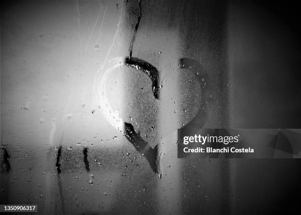 heart drawn on a glass with raindrops - monochrome bathroom stock pictures, royalty-free photos & images