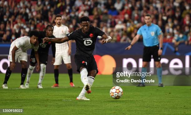 Jonathan David of Lille OSC scores their team's first goal from the penalty spot during the UEFA Champions League group G match between Sevilla FC...