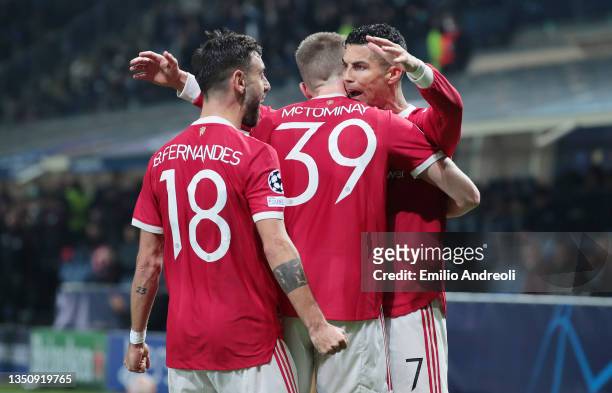 Cristiano Ronaldo of Manchester United celebrates with teammates Scott McTominay and Bruno Fernandes after scoring their side's first goal during the...