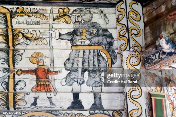 painting of david and goliath decorates the interior of the rose church - david goliath stock-fotos und bilder