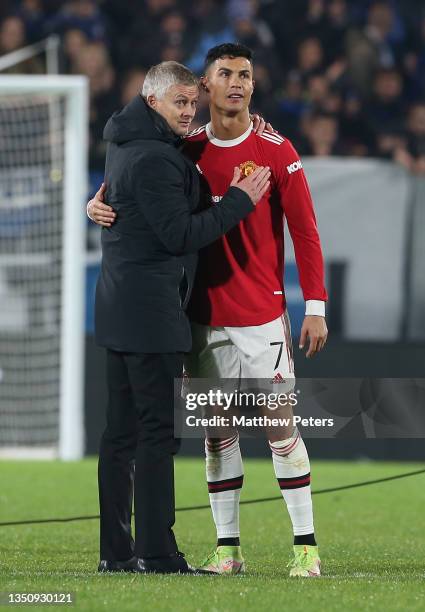 Manager Ole Gunnar Solskjaer of Manchester United walks off with Cristiano Ronaldo after the UEFA Champions League group F match between Atalanta and...