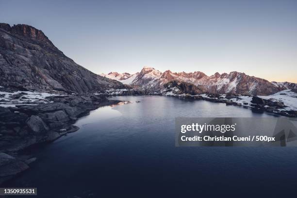 scenic view of lake and mountains against clear sky,canton of bern,switzerland - jura suisse photos et images de collection