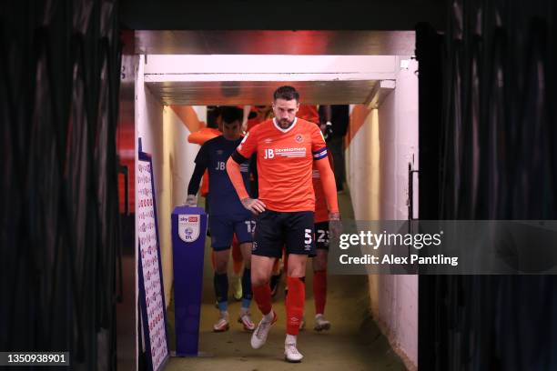 Sonny Bradley of Luton Town leads out his side for the second half during the Sky Bet Championship match between Luton Town and Middlesbrough at...
