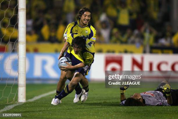 Seiichiro Maki of JEF United Chiba celebrates scoring his side's second goal with his team mate Takenori Hayashi during the J.League J1 match between...