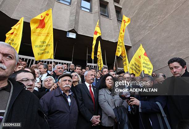 Relatives of the 37 secular intellectuals killed in an arson, lawyers and politicians gather after an hearing outside a courthouse in the central...