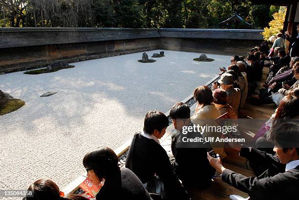 The Zen garden in the Ryoanji Temple on November 17,2011 in Kyoto,Japan. One of the most famous stone gardens in front of the temple where zen monks...