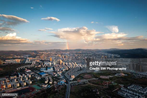 rainbow and cityscape of chuxiong city, yunnan province, china - sri lanka skyline stock pictures, royalty-free photos & images