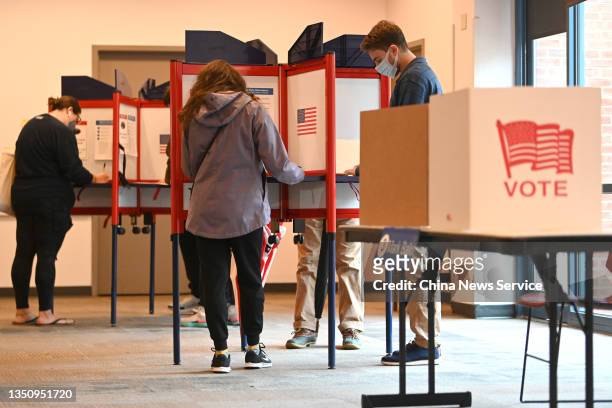 Voters cast ballots at a polling location in Arlington during the Virginia governor election on November 2, 2021 in Virginia, United States.