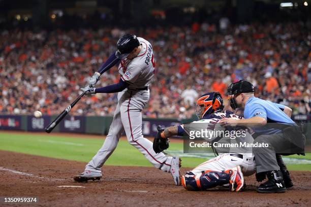 Freddie Freeman of the Atlanta Braves hits a solo home run against the Houston Astros during the sixth inning in Game Six of the World Series at...