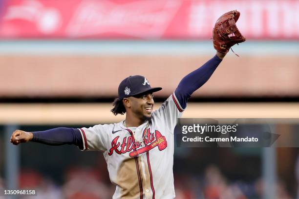Ozzie Albies of the Atlanta Braves celebrates with teammates after their 7-0 victory against the Houston Astros in Game Six to win the 2021 World...