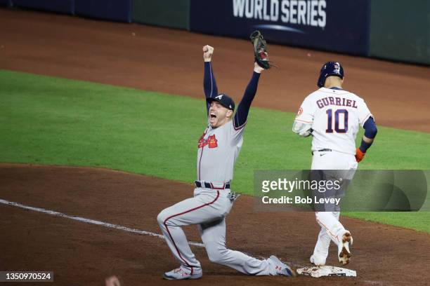 Freddie Freeman of the Atlanta Braves celebrates as he records the final out against Yuli Gurriel to secure the team's 7-0 victory against the...