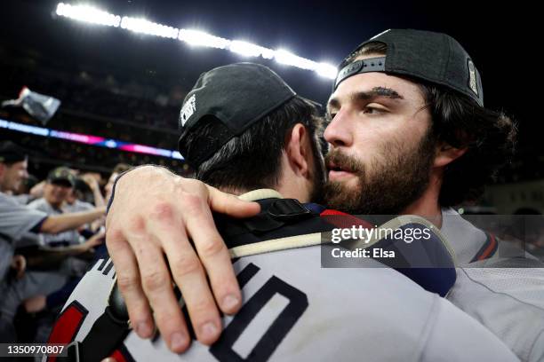 Dansby Swanson of the Atlanta Braves celebrates with Travis d'Arnaud after their 7-0 victory against the Houston Astros in Game Six to win the 2021...