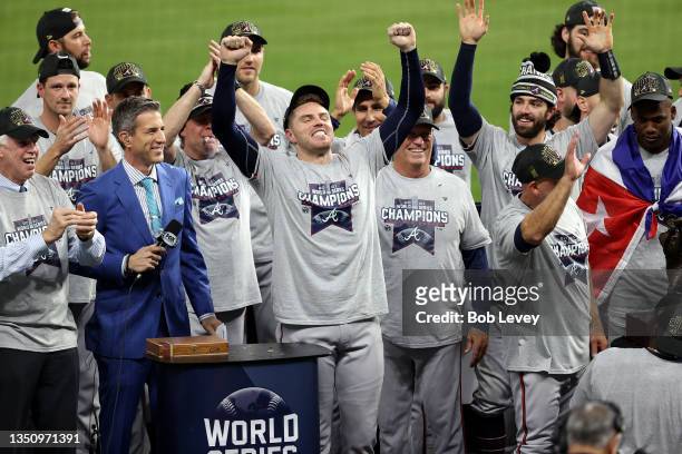 Freddie Freeman of the Atlanta Braves celebrates with teammates after their 7-0 victory against the Houston Astros in Game Six to win the 2021 World...