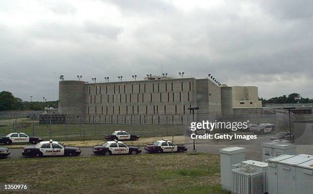 Sheriff's cars are shown parked in front of the Suffolk County Correctional Facility August 23, 2002 in Riverhead, New York. The facility is where...